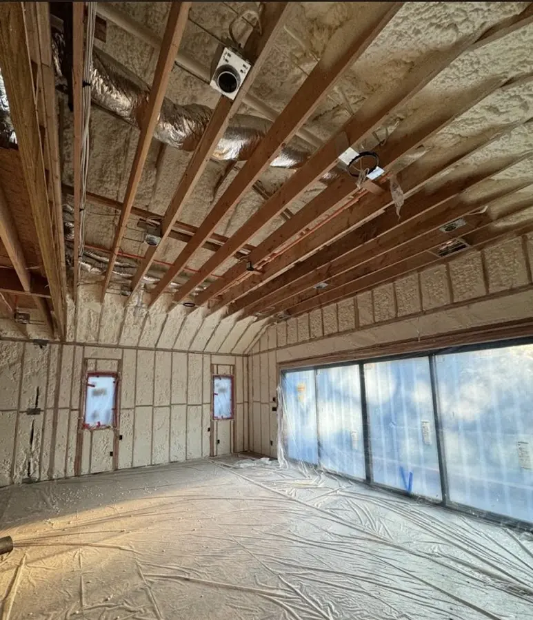 Interior walls and ceiling insulated with spray foam during new construction in Weirton